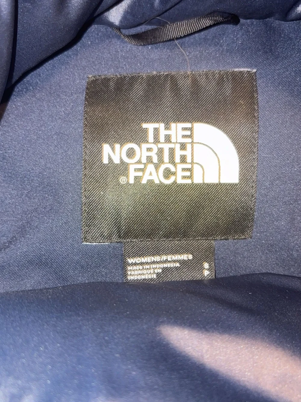 The North Face women’s Navy Puffer Jacket with Faux Fur Trim Hood